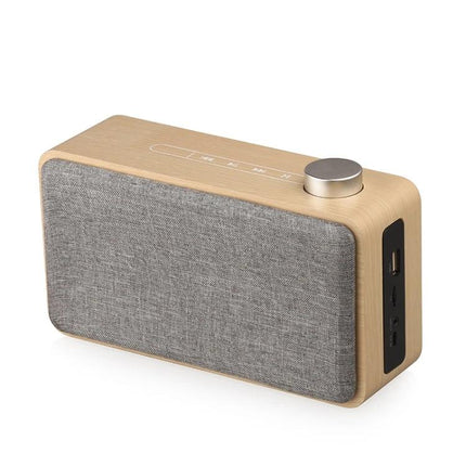Compact Bluetooth Speaker For Home And Travel With Portable Design with metal knob, touch controls, fabric front and side ports