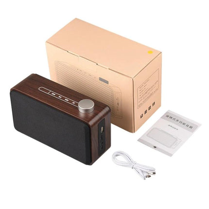 Compact Bluetooth Speaker For Home And Travel With Portable Design showing wooden finish speaker, knob, cable, manual, and box