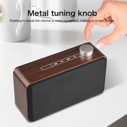 Compact Bluetooth Speaker For Home And Travel With Portable Design showing metal tuning knob and touch controls on wood finish