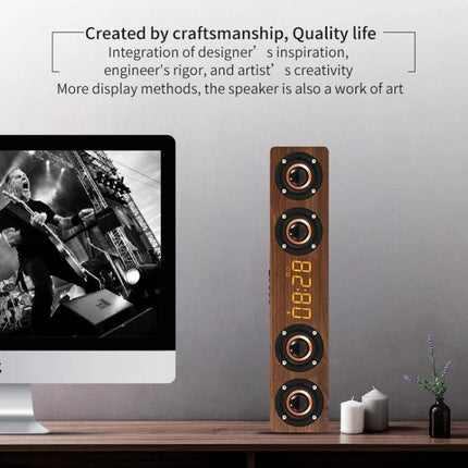 Wooden Clock Speaker With LED Clock For Home Use And Alarm displayed on a slim wood tower speaker on desk