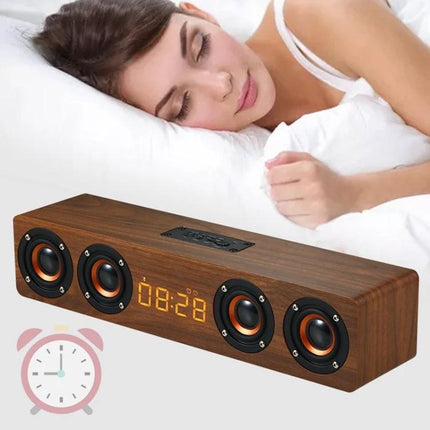Wooden Clock Speaker With LED Clock For Home Use And Alarm on bedside table showing LED time and stereo speakers