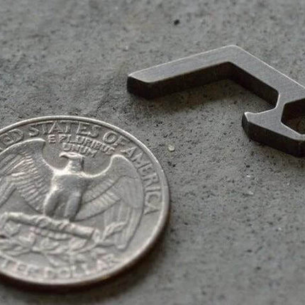 EDC Mini Bottle Opener Keyring Titanium Alloy For Camping And Hiking compact titanium keyring opener next to US quarter for scale