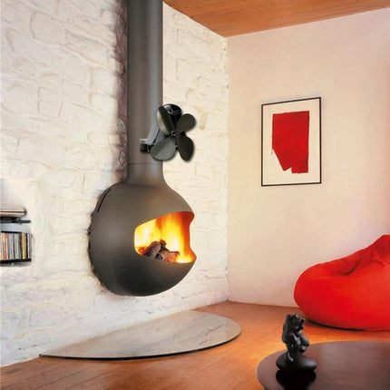 Quiet Aluminum Heat-Powered Fan for Fireplace Air Circulation mounted on wood stove circulating warm air in modern living room