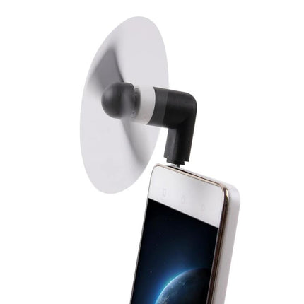 Compact Portable Fan for Smartphone Cooling via USB-C Port attached to phone showing clip-on design for gaming and video use