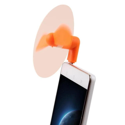 Compact Portable Fan for Smartphone Cooling via USB-C Port attached to phone in use, orange mini fan for gaming and video