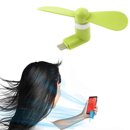 Compact Portable Fan for Smartphone Cooling via USB-C Port attached to phone, green USB‑C mini fan preventing overheating during gaming and video