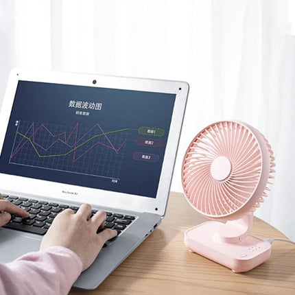 Compact Rechargeable Desktop Fan with Adjustable Speeds for Home and Office on desk next to laptop for quiet cooling