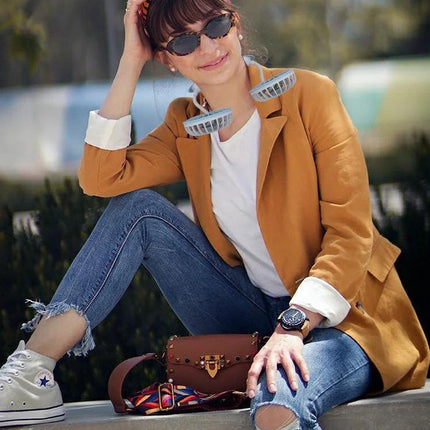 Compact USB-Charged Hanging Neck Fan for Portable Cooling worn by woman outdoors for hands-free personal cooling