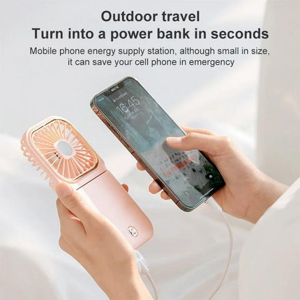 Portable F30 Hanging Neck and Handheld Fan for Daily Cooling charging a smartphone as a portable power bank during outdoor travel