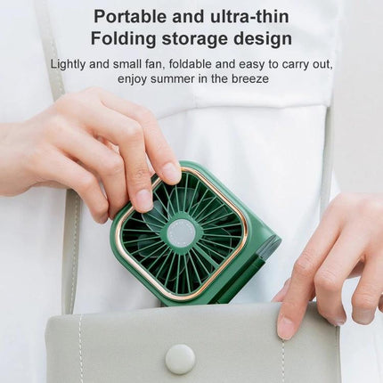 Portable F30 Hanging Neck and Handheld Fan for Daily Cooling - compact green foldable handheld and hanging fan being placed into a purse