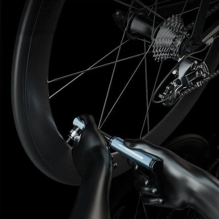 ENLEE Portable Bicycle Hand Pump for Schrader and Presta Valves compact aluminum bike inflator with CNC grip shown inflating wheel