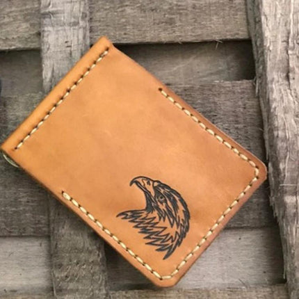 NEJE Bluetooth Laser Engraver for Creative DIY Projects engraving an eagle design on a tan leather wallet, home DIY craft precision