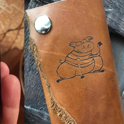 NEJE Bluetooth Laser Engraver for Creative DIY Projects engraving a pig sketch on a leather wallet for personalized gifts