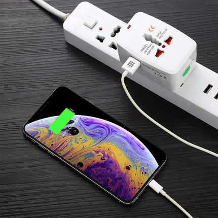 Essential Adapter for Charging Devices During International Travel charging two devices: smartphone and adapter plugged into power strip