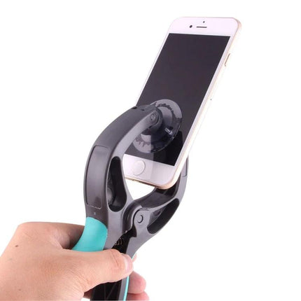 39 in 1 Multi-Purpose Tool Set for Phone Repairs - hand using suction clamp to lift smartphone screen during repair
