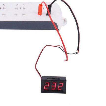 Compact Digital Voltage Meter for Everyday Electronics Checking showing red LED 232 reading connected to a power strip for battery and power supply testing