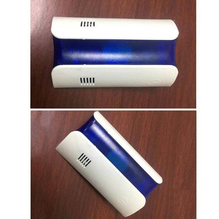 Electromagnetic Wave Mosquito Repeller For Home Use US Plug white and blue ABS housing on wooden surface, chemical-free pest control device