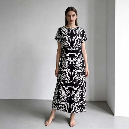 Elegant Loose Fitting Long Dress With Sailor Collar in black-and-white bold print knitted fabric on model, loose relaxed fit, vintage-inspired styling
