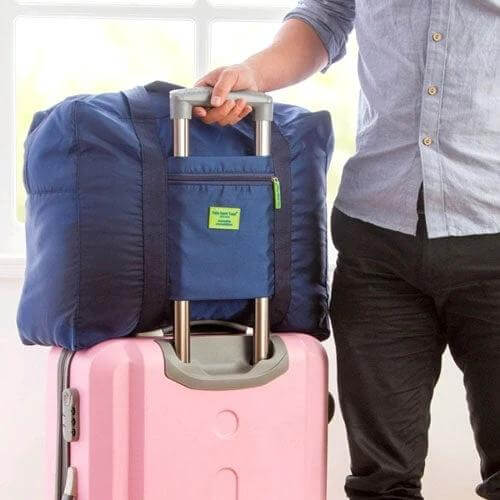 Embellish Foldable Travel Pouch Waterproof Nylon 44x35x19cm navy travel pouch on pink suitcase handle, lightweight foldable waterproof packing bag