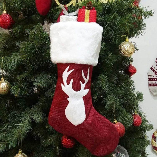 Embroidered Christmas Stocking Ornament Gift Bag Snowflake Style soft red stocking with white cuff and deer silhouette on Christmas tree