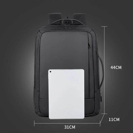 Expandable Business Waterproof Laptop Backpack For Work With USB Port shown front view with dimensions 44cm x 31cm x 11cm and tablet for scale