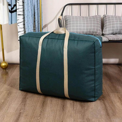 Extra Large Foldable Moving Storage Tote For Clothes in green non-woven fabric with beige handles and large zipper, packed with garments