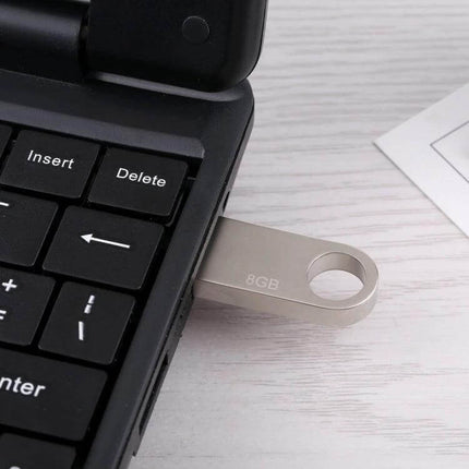 8GB Metal USB Flash Drive for Easy Data Storage and Transfer - metal USB stick plugged into laptop for secure, portable file transfer