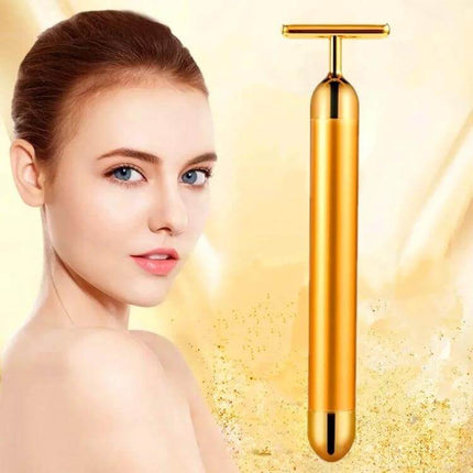 Face Massager Stick Wireless Facial Relaxation Tool gold T-shaped cordless micro-vibration facial massager shown with model