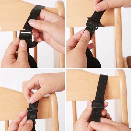 Five Point Child Safety Belt For Stroller Seats Everyday Use - black adjustable polyester strap being threaded and buckled onto a wooden chair for child restraint