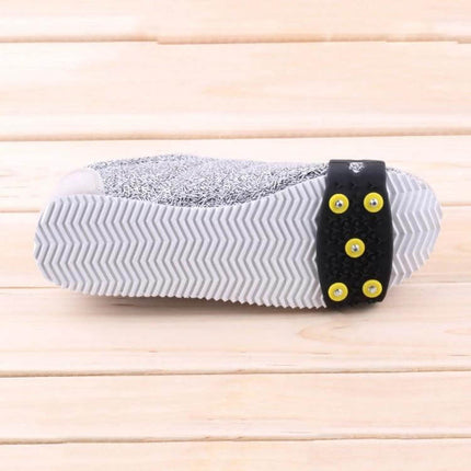 Five-Tooth Ice Claw Overshoes For Snow And Ice Outdoor Use – black rubber overshoe with five steel-studded yellow nails fitted on a sneaker sole