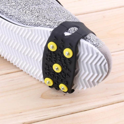 Five-Tooth Ice Claw Overshoes For Snow And Ice Outdoor Use on a sneaker showing five-tooth steel nails for traction