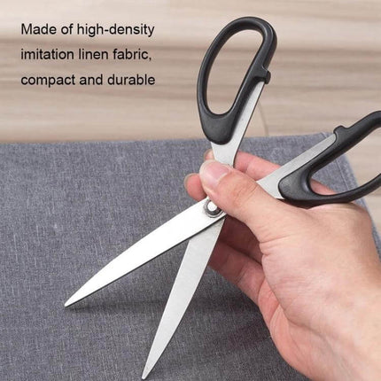 Foldable Drawer Clothes Storage Box, 24 Grids Gray shown with durable gray linen-like fabric being cut with scissors to demonstrate material strength