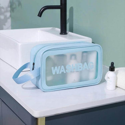 Frosted Translucent Waterproof Storage Bags 2 Pack For Travel blue frosted toiletry washbag with zipper on bathroom counter