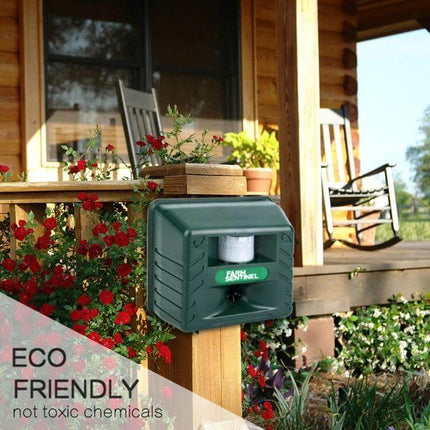 Garden Ultrasonic Rat and Snake Repeller for Outdoor Use mounted on porch post protecting garden beds