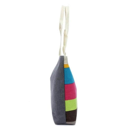 Green Canvas Stripe Shoulder Bag For Everyday Use All Day - side view of green canvas stripe shoulder bag with colorful stripe panels and cream straps