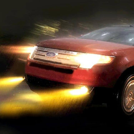 H11 HOD Halogen Bulbs 2-Pack Yellow Light For Car Headlights - yellow beam on red Ford sedan in wet night driving scene