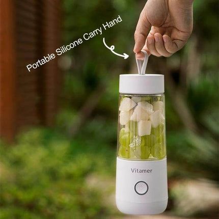 USB Mini Portable Juicer Cup 350ml For Smoothies On The Go - compact white rechargeable blender with silicone carry handle, filled with fruit