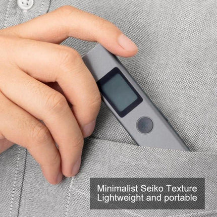 Xiaomi Youpin Portable Laser Distance Measurer with 40m Range in pocket showing minimalist lightweight design and digital display