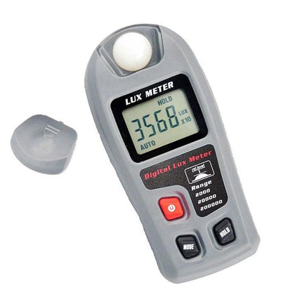 Portable Digital Lux Meter for Home and Workplace Use handheld gray lux meter showing 3568 reading with protective cap removed