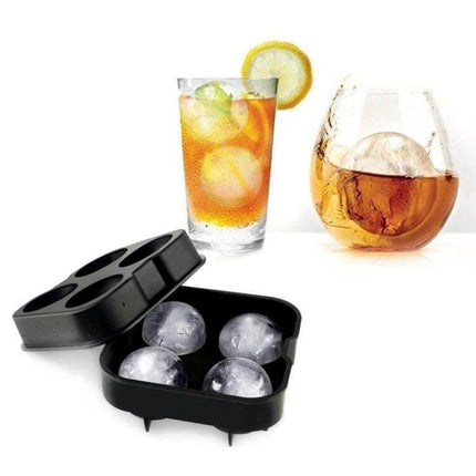 Ball Shape Silicone Ice Cube Mold, 4-Grid for Round Ice Cubes - black silicone tray with four clear spherical ice balls next to cocktail and whiskey glass