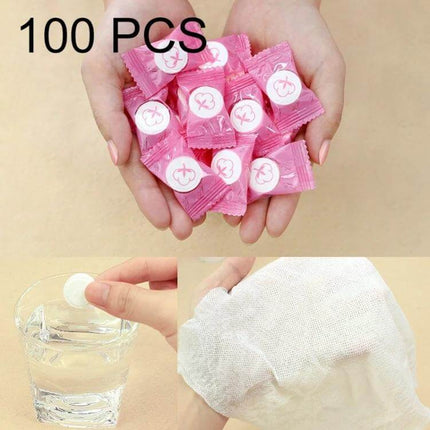 Candy Style Portable Disposable Cotton Towel 22x20cm For Daily Use - hands holding pink wrapped compressed towels and unfolded cotton wipe