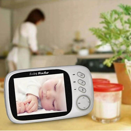 Wireless Baby Monitor with Night Vision and Two-Way Communication showing sleeping infant on screen and parent in background