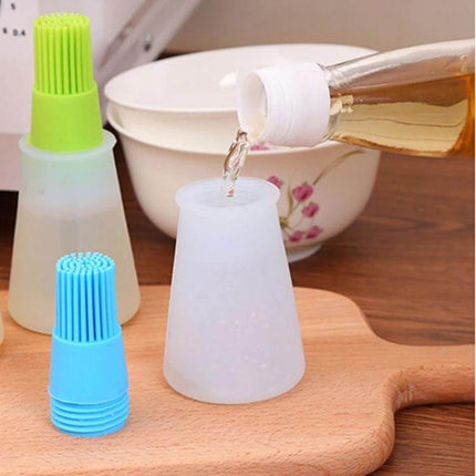 Kitchen Silicone Oil Brush Bottle 70ml - 70ml silicone oil brush bottle with removable brush caps, shown being filled for cooking and glazing