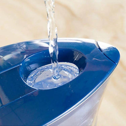 1.3L Portable Water Bottle With Activated Carbon Filter, Blue - blue portable bottle being filled with water, showing top fill and filter opening
