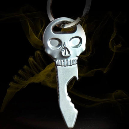 Skull Shaped Multi-Function Bottle Opener Key Chain Accessory in zinc alloy hanging on keyring, compact skull design for bottles and keys