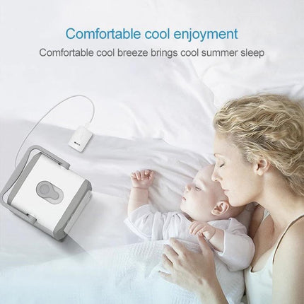 Compact Portable USB Air Cooler for Everyday Home Cooling on bedside table near sleeping mother and baby, USB-powered personal desk cooler