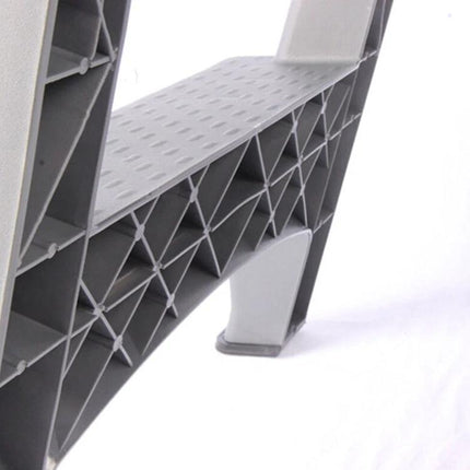 Compact Folding Ladder for Daily Home Tasks close-up of durable plastic step and support structure, non-slip tread and stabilizing foot