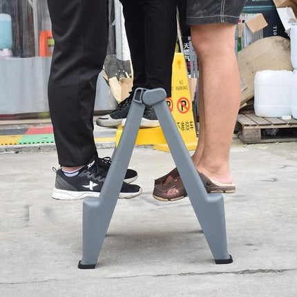 Compact Folding Ladder for Daily Home Tasks compact two-step folding ladder in use for reaching high shelves and light bulbs