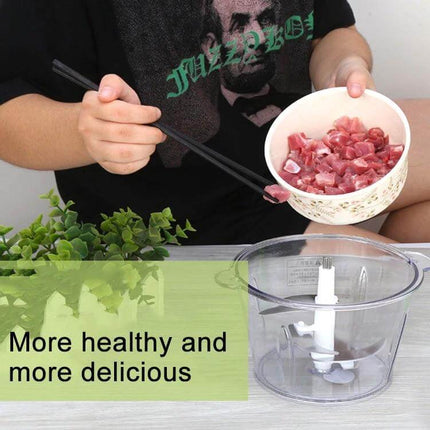 Multi Function Electric Kitchen Shredder Stirrer For Everyday Use compact chopper with stainless steel blades and 2L bowl showing diced meat being added