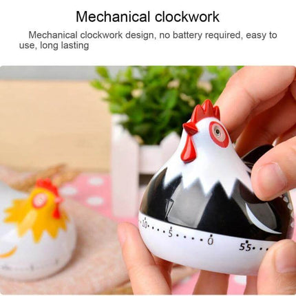 Chicken Shape 60-Minute Mechanical Kitchen Timer For Everyday Cooking - black and white chicken kitchen timer held in hand, mechanical dial up to 60 minutes